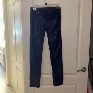 black leather pants , gold buttons